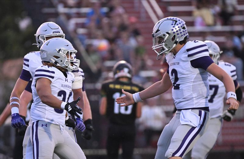 Bloomington South’s Shaun Cooper (34) and Duncan Combs (2) celebrate after a touchdown during the football game at Terre Haute South on Friday, Sept. 19, 2025.