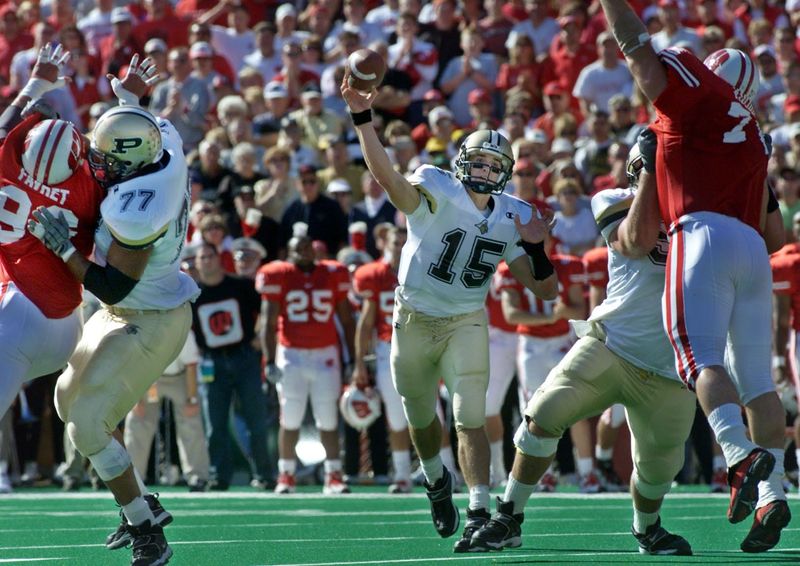 Purdue's Drew Brees throws a touchdown pass to A.T. Simpson at Wisconsin on October 21, 2000. Purdue won the 30-24 thriller.