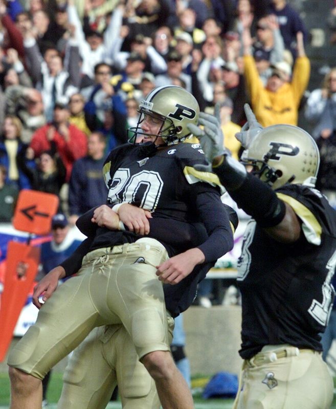 Purdue's Travis Dorsch is lifted in celebration after kicking the game winning field goal during the Boilermakers upset win over the Wolverines 32-31 in West Lafayette.
