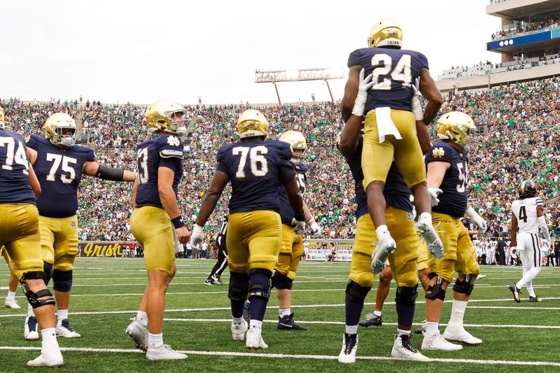 Notre Dame running back Jadarian Price (24) celebrates after scoring a touchdown during the first half of a NCAA football game against Purdue at Notre Dame Stadium on Saturday, Sept. 20, 2025, in South Bend.