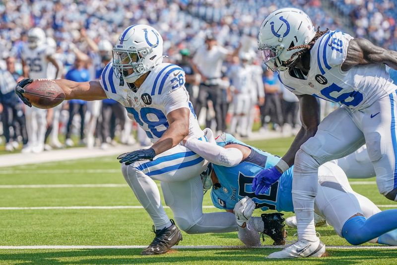 Indianapolis Colts running back Jonathan Taylor (28) stretches in for a touchdown during the fourth quarter against the Tennessee Titans at Nissan Stadium in Nashville, Tenn., Sunday, Sept. 14, 2025.