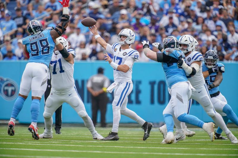 Indianapolis Colts quarterback Daniel Jones (17) throws for a first down during the first quarter against the Tennessee Titans at Nissan Stadium in Nashville, Tenn., Sunday, Sept. 21, 2025.