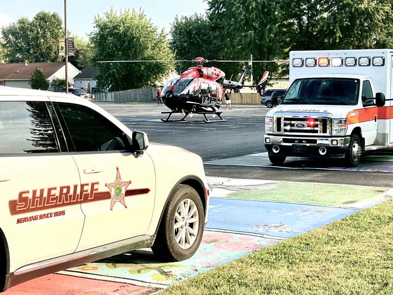 Lifeline helicopter lands at McCutcheon High School parking lot on Wednesday, Sept. 24, 2025, to airlift a motorcyclist to an Indianapolis hospital after an accident near the school.