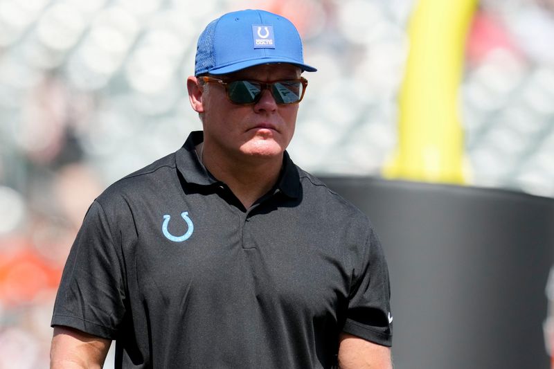 Indianapolis Colts general manager Chris Ballard leaves the field Saturday, Aug. 23, 2025, during a game against the Cincinnati Bengals at Paycor Stadium in Cincinnati.