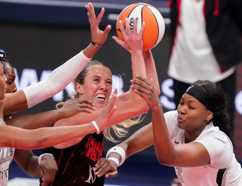Indiana Fever guard Lexie Hull (10) pushes to the net past Las Vegas Aces forward NaLyssa Smith (3) on Friday, Sept. 26, 2025, during Game 3 of the WNBA semifinals at Gainbridge Fieldhouse in Indianapolis.