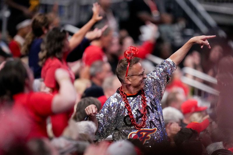 Fans cheer on the Indiana Fever on Friday, Sept. 26, 2025, during Game 3 of the WNBA semifinals against the Las Vegas Aces at Gainbridge Fieldhouse in Indianapolis.