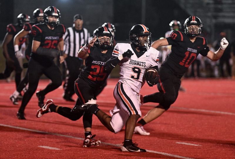 Beech Grove’s Caron Parks (9) runs the ball past Edgewood’s Rowan Heitink (25) during the football game at Edgewood on Friday, Sept. 26, 2025.