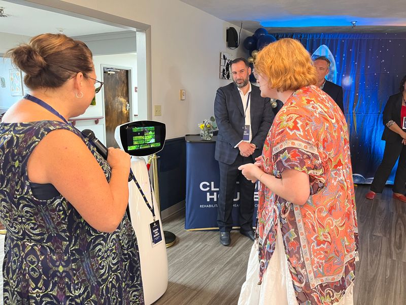 Saedie Spikes, a dementia specialist at the Lafayette-based nonprofit Area IV Agency, plays a puzzle game with Robin the Robot.