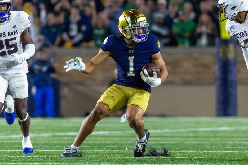 Sep 13, 2025; South Bend, Indiana, USA; Notre Dame Fighting Irish wide receiver Jaden Greathouse (1) runs with the ball during the second half against the Texas A&M Aggies at Notre Dame Stadium. Mandatory Credit: Michael Caterina-Imagn Images