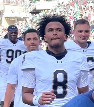 Kenny Minchey (8), redshirt sophomore quarterback for Notre Dame football, exits Frank Broyles Field after playing the final quarter of a 56-13 win over Arkansas on Sept. 27, 2025.