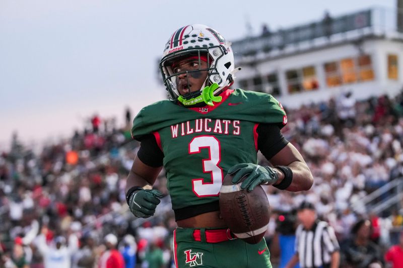 Lawrence North Wildcats running back Izayveon Moore (3) scores a touchdown Friday, Oct. 3, 2025, during a game between the Lawrence North Wildcats and Warren Central at Lawrence North High School in Indianapolis.