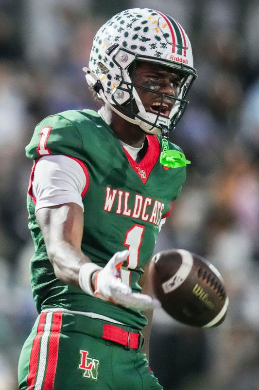 Lawrence North Wildcats Monshun Sales (1) celebrates after catching a pass Friday, Oct. 3, 2025, during a game between the Lawrence North Wildcats and Warren Central at Lawrence North High School in Indianapolis.