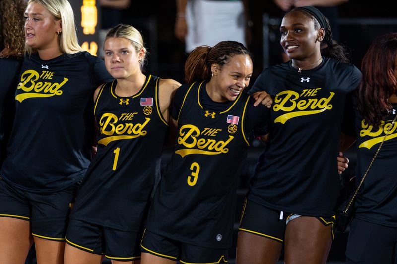 Women’s basketball players sing the Notre Dame Alma Mater during the Irish Jam event Friday, Oct. 3, 2025 at Eddy Street Commons in South Bend.