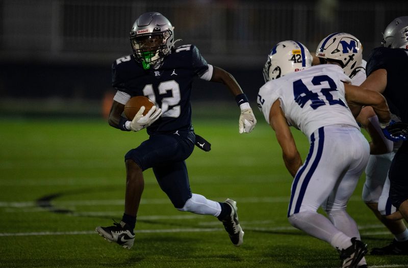 Reitz’s Amyr Wilford (12) runs the ball as the Reitz Panthers play the Memorial Tigers at the Reitz Bowl in Evansville, Ind., Friday, Oct. 3, 2025.