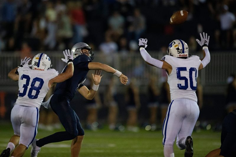 Reitz's Parker Baumeyer (4) passes as the Reitz Panthers play the Memorial Tigers at the Reitz Bowl in Evansville, Ind., Friday, Oct. 3, 2025.