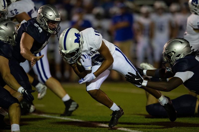 Memorial's Dylen Kendrick (18) carries the ball as the Reitz Panthers play the Memorial Tigers at the Reitz Bowl in Evansville, Ind., Friday, Oct. 3, 2025.