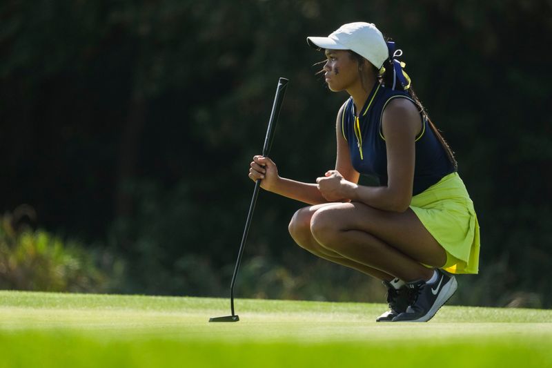 Castle’s Ava Ragland eyes her putt on the 18th green Saturday, Oct. 4, 2025, during day 2 of the 53rd IHSAA girls golf state championships at Prairie View Golf Club in Carmel.
