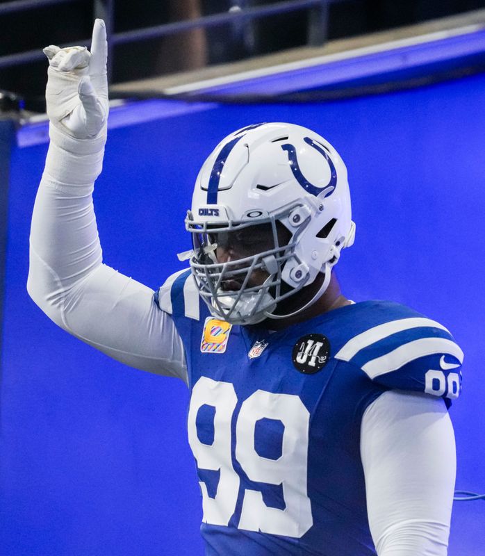 Indianapolis Colts defensive tackle Deforest Buckner (99) points up while running onto the field Sunday, Oct. 5, 2025, during a game against the Las Vegas Raiders at Lucas Oil Stadium in Indianapolis.