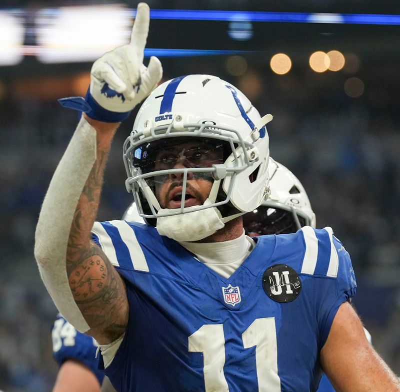 Indianapolis Colts wide receiver Michael Pittman Jr. (11) celebrates after scoring a touchdown against the Las Vegas Raiders on Sunday, Oct. 5, 2025, during a game at Lucas Oil Stadium in Indianapolis.