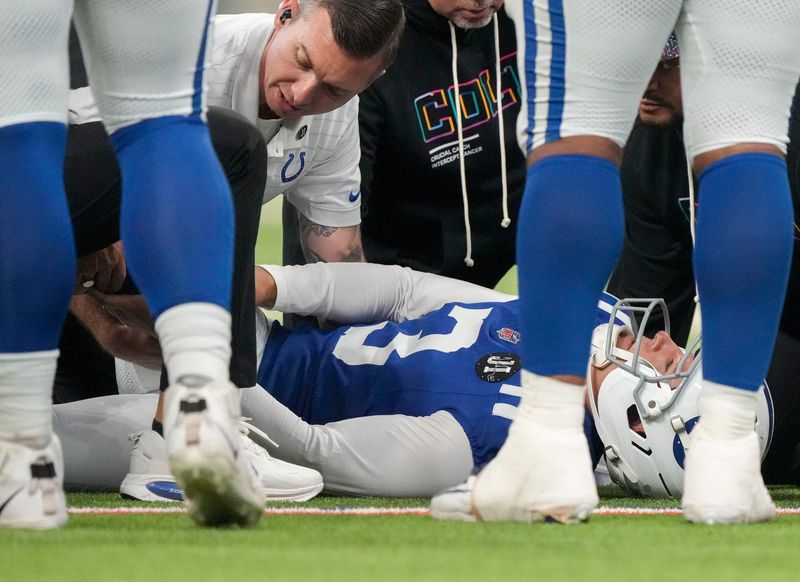 Indianapolis Colts kicker Spencer Shrader (3) is attended to Sunday, Oct. 5, 2025, during a game against the Las Vegas Raiders at Lucas Oil Stadium in Indianapolis.