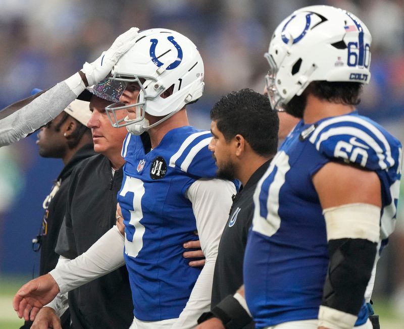 Indianapolis Colts kicker Spencer Shrader (3) is walked off the field Sunday, Oct. 5, 2025, during a game against the Las Vegas Raiders at Lucas Oil Stadium in Indianapolis.