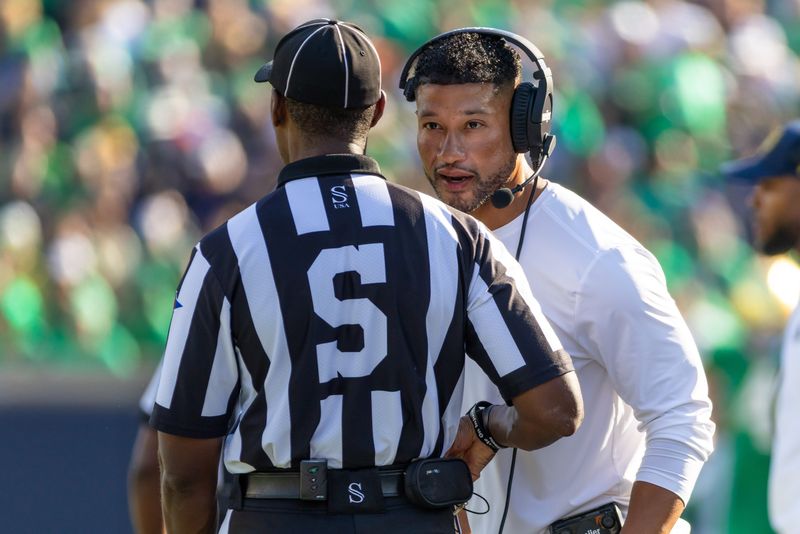 Oct 4, 2025; South Bend, Indiana, USA; Notre Dame Fighting Irish head coach Marcus Freeman talks to an official during the first half at Notre Dame Stadium. Mandatory Credit: Michael Caterina-Imagn Images