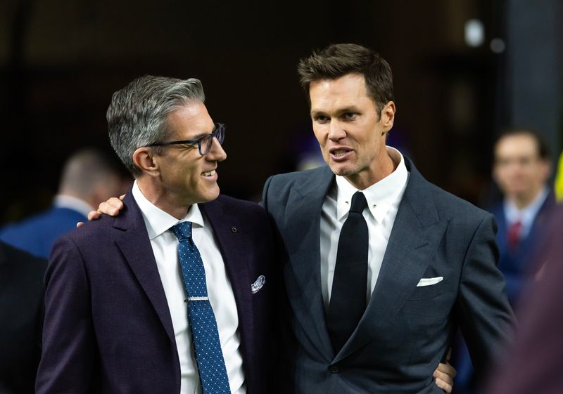 FOX Sports announcer Kevin Burkhardt (left) with Tom Brady.