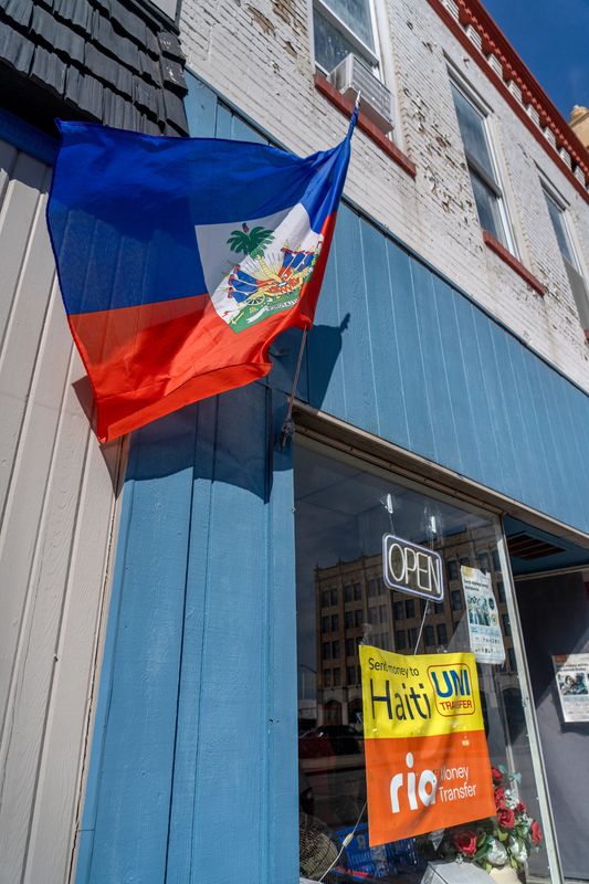 A Haitian flag waves outside a store on Main Street in Washington, Indiana, on Oct. 1, 2025.