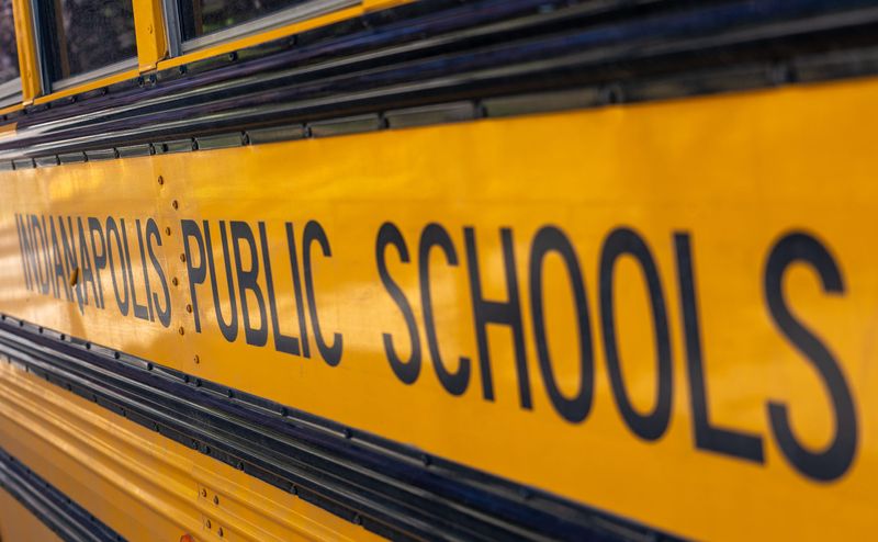 An Indianapolis Public Schools bus is parked Wednesday, Oct. 8, 2025, outside William Bell School 60.