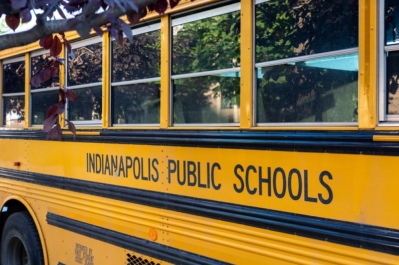 An Indianapolis Public Schools bus is parked Wednesday, Oct. 8, 2025, outside William Bell School 60.