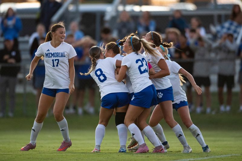 The Memorial Lady Tigers cheer after Memorial's Norah Havill (3) scores as the Memorial Lady Tigers play the Jasper Lady Wildcats in the 2025 IHSAA Class 3A Girls Soccer sectional semifinal at Castle High School in Newburgh, Ind., Thursday, Oct. 9, 2025.