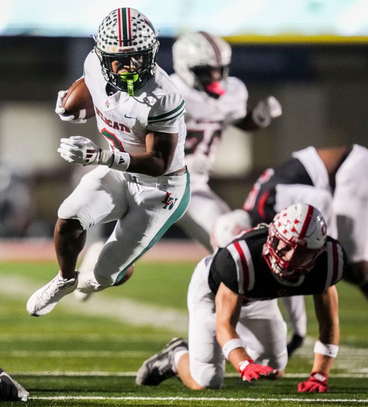 Lawrence North Wildcats running back Izayveon Moore (3) runs the ball Friday, Oct. 10, 2025, during a game between Center Grove and the Lawrence North Wildcats at Center Grove High School in Greenwood.