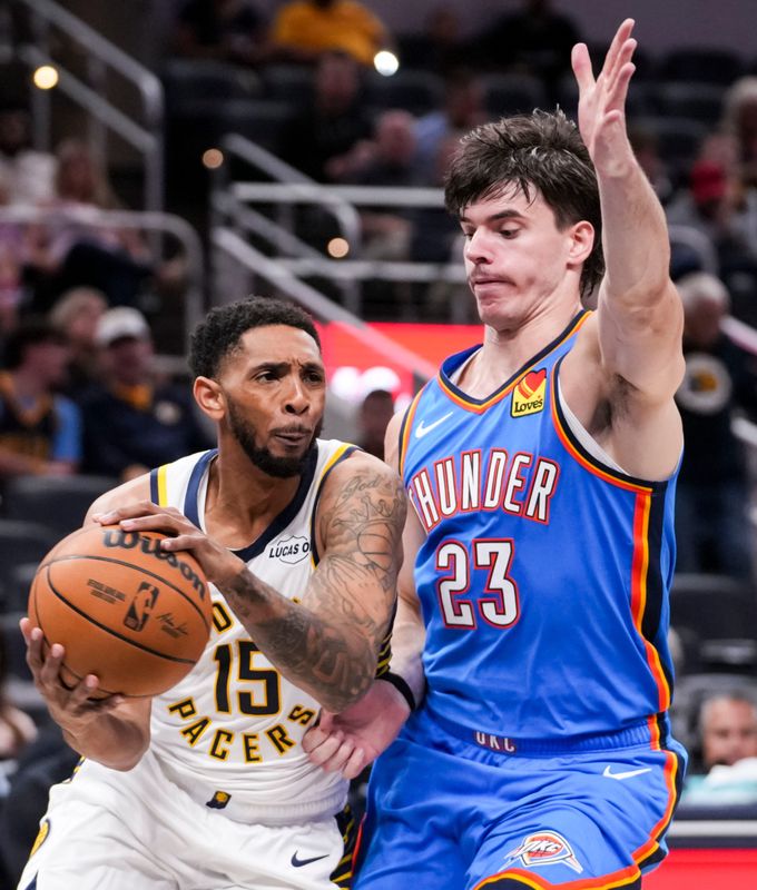 Indiana Pacers Cameron Payne (15) runs a play against Oklahoma City Thunder guard Brooks Barnhizer (23) on Saturday, Oct. 11, 2025, during a preseason game between the Indiana Pacers and the Oklahoma City Thunder at Gainbridge Fieldhouse in Indianapolis.