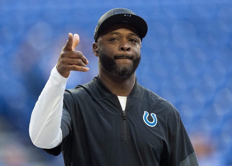Indianapolis Colts wide receivers coach Reggie Wayne interacts with fans Sunday, Oct. 12, 2025, ahead of the game against the Arizona Cardinals at Lucas Oil Stadium in Indianapolis.