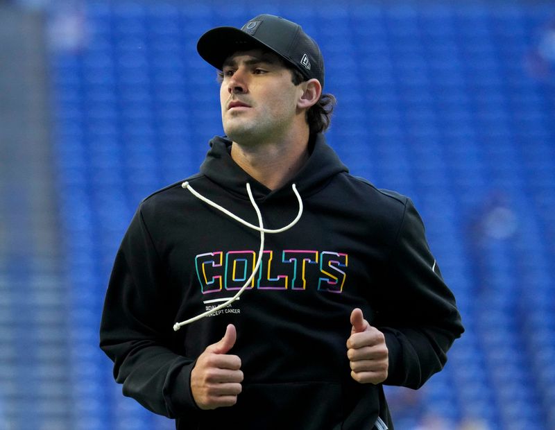 Indianapolis Colts quarterback Daniel Jones (17) warms up before a game against the Arizona Cardinals on Sunday, Oct. 12, 2025, at Lucas Oil Stadium in Indianapolis.