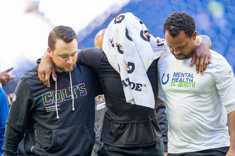 Indianapolis Colts cornerback Charvarius Ward (7) is walked off the field Sunday, Oct. 12, 2025, ahead of the game against the Arizona Cardinals at Lucas Oil Stadium in Indianapolis.