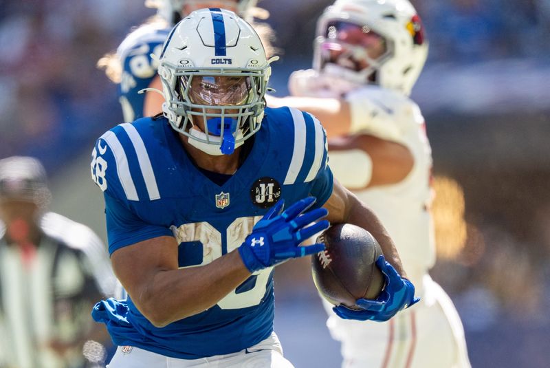 Indianapolis Colts running back Jonathan Taylor (28) runs Sunday, Oct. 12, 2025, against the Arizona Cardinals at Lucas Oil Stadium in Indianapolis.