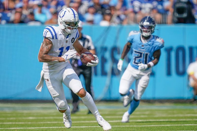 Indianapolis Colts wide receiver Michael Pittman (11) runs the ball against the Tennessee Titans during the third quarter at Nissan Stadium in Nashville, Tenn., Sunday, Sept. 21, 2025.