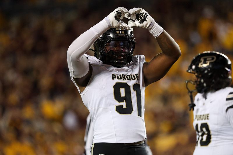 Oct 11, 2025; Minneapolis, Minnesota, USA; Purdue Boilermakers defensive lineman CJ Nunnally (91) gestures toward the crowd against the Minnesota Golden Gophers during the first half at Huntington Bank Stadium. Mandatory Credit: Matt Krohn-Imagn Images