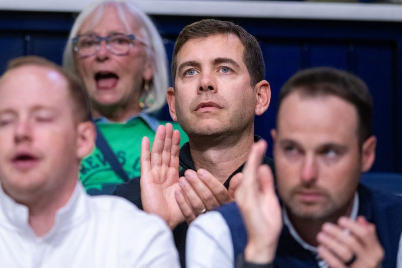 Former Butler head coach Brad Stevens watches from courtside during an exhibition game between Butler and Notre Dame, Thursday, Oct. 17, 2025, in Indianapolis. Stevens, now president of basketball operations for the Boston Celtics, led the Bulldogs to consecutive NCAA championship game appearances in 2010 and 2011 before departing for the NBA.