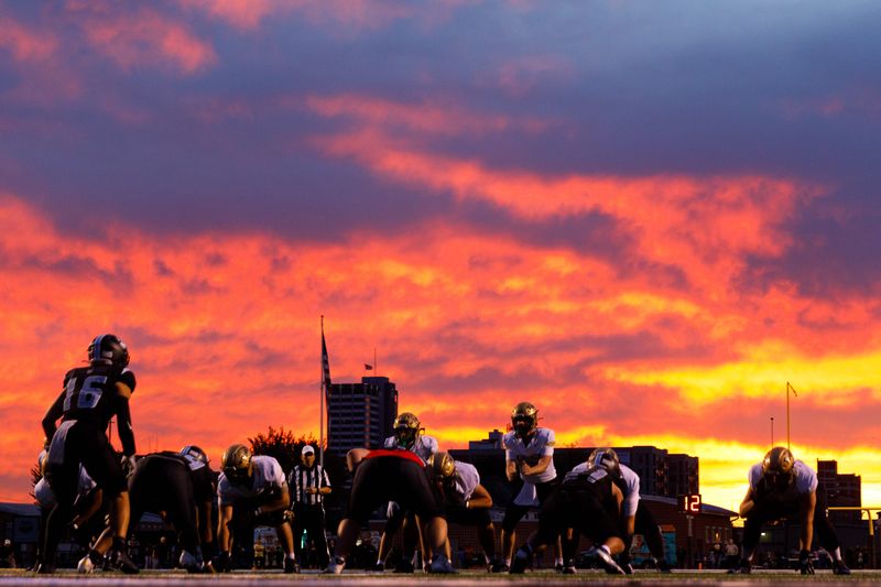 The sun sets over an IHSAA football game between Saint Joseph and Penn at Saint Jospeh High School on Friday, Oct. 17, 2025, in South Bend.