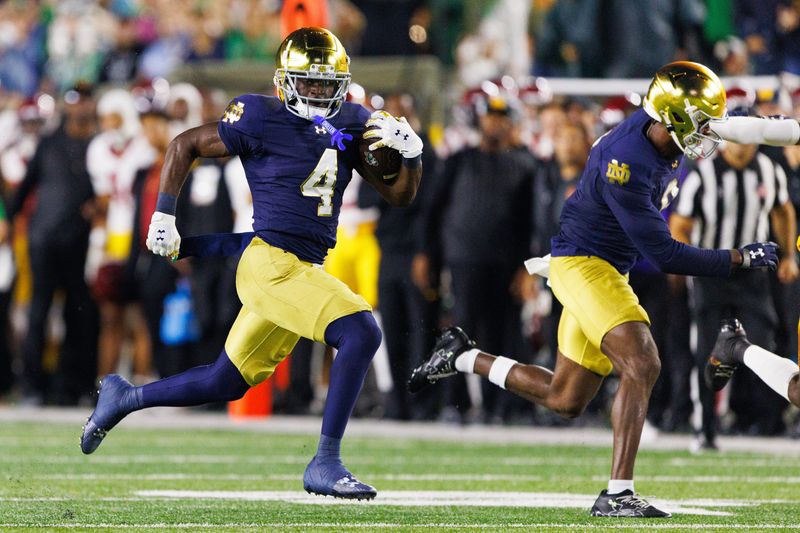 Notre Dame running back Jeremiyah Love (4) runs with the ball in the first half of a NCAA football game against Southern California at Notre Dame Stadium on Saturday, Oct. 18, 2025, in South Bend.