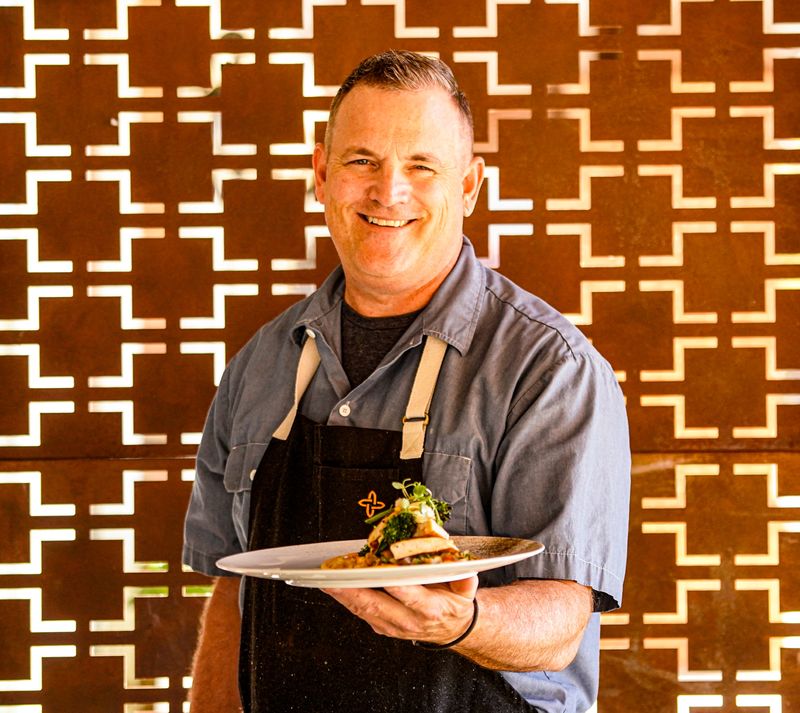 Steven Oakley, chef-owner of Oakley’s Bistro holds his Indiana chicken schnitzel, $38.75 on Tuesday, Oct. 21, 2025, in Indianapolis.