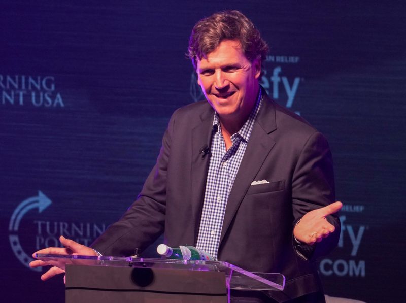 Former Fox News host Tucker Carlson speaks Tuesday, Oct. 21, 2025, during a Turning Point USA tour stop at the Indiana University Auditorium in Bloomington.