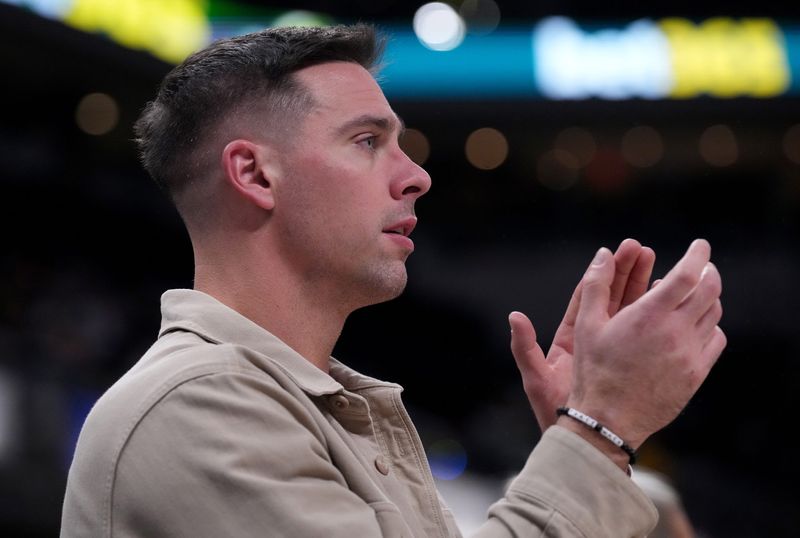 Indiana Pacers guard T.J. McConnell cheers from the bench Thursday, Oct. 23, 2025, during the game against the Oklahoma City Thunder at Gainbridge Fieldhouse in Indianapolis.
