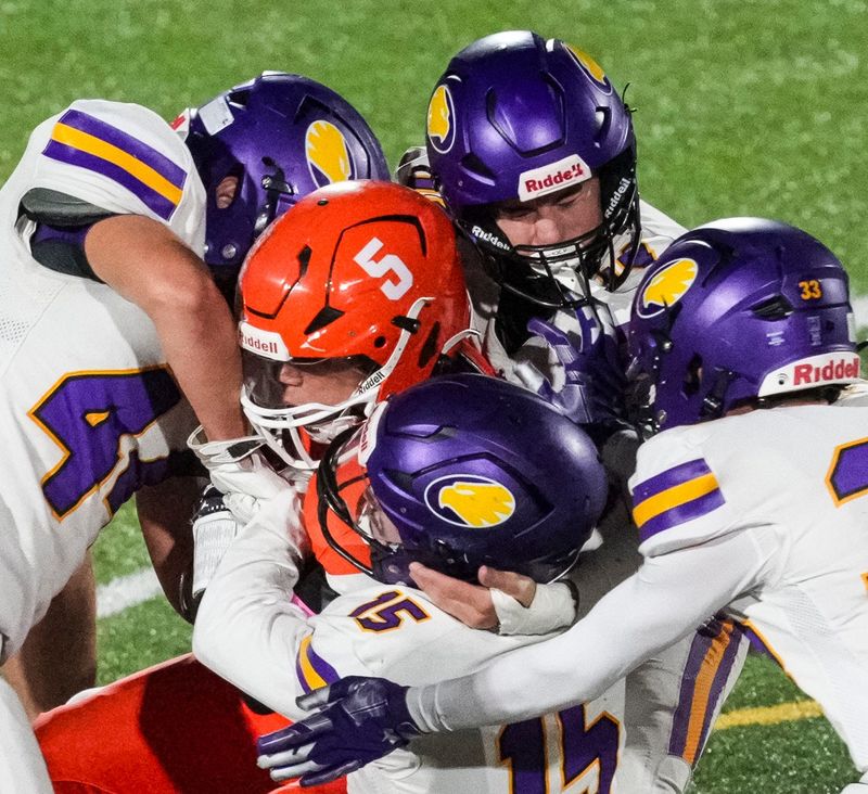 Hamilton Heights Huskies Dre Chandler (5) gets taken down Friday, Oct. 24, 2025, during a game between the Hamilton Heights Huskies and the Guerin Catholic Golden Eagles at Hamilton Heights High School in Arcadia, Ind.