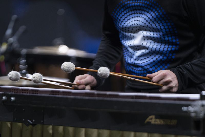 A member of the Noblesville High School marching band pit plays the marimba during the Bands of America Indianapolis Super Regional Championship Finals on Oct. 25, 2025, at Lucas Oil Stadium in Indianapolis, Indiana; Jacob Musselman/ for IndyStar