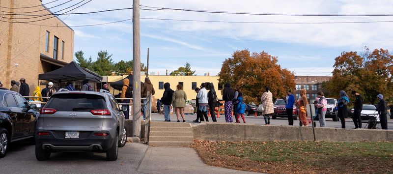 People wait in line Monday, Oct. 27, 2025, at Mid-North Food Pantry just off Meridian Street in Indianapolis. “Numbers show that SNAP accounts for about 60% of the free or subsidized Food that people receive,” Steven Slaubaugh, director of operations at Mid-North Food Pantry, said. “Food pantries, at the moment, provide about 5% of that. People aren't receiving SNAP benefits next month. Food pantries are going to be seeing a lot more folks and the truth is, we don't have the capacity to cover that 60%.”