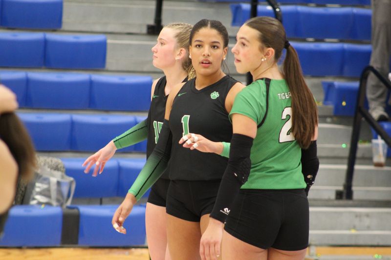 Yorktown volleyball's Mya Trammell (1) talks to Chloe Ritchie (2) during Yorktown's win over Center Grove in the IHSAA Class 4A regional championship at Greenfield-Central High School on Saturday, Oct. 25, 2025.