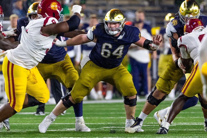 Oct 18, 2025; South Bend, Indiana, USA; Notre Dame Fighting Irish offensive lineman Joe Otting (64) blocks against the Southern California Trojans during the second half at Notre Dame Stadium. Mandatory Credit: Michael Caterina-Imagn Images